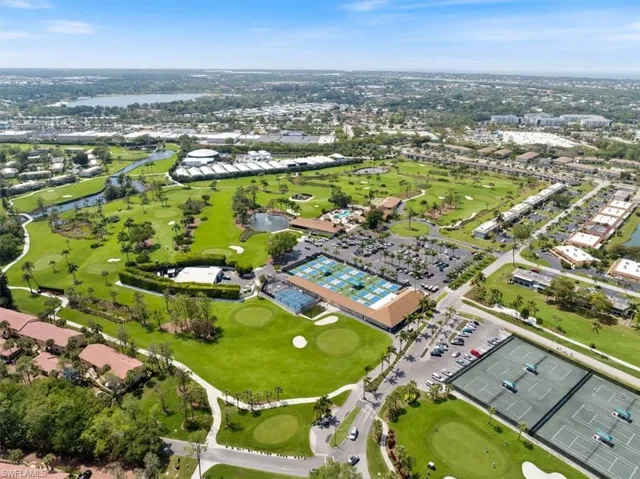 Birds eye view of property with a water view