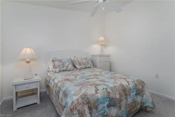 Light-colored room featuring neutral walls and grey carpeting
