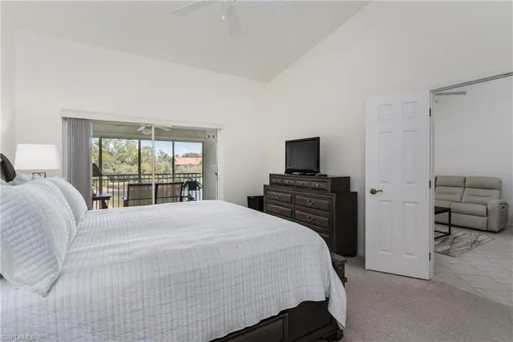 Vaulted ceiling room with private balcony access