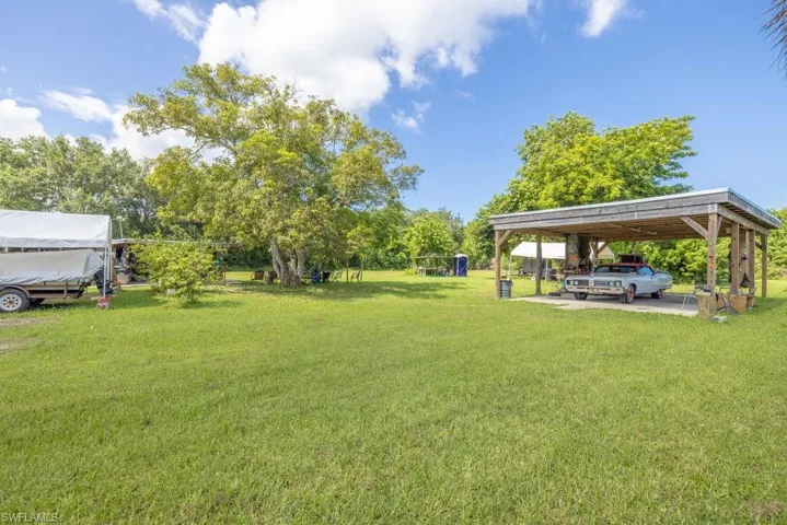 View of yard featuring a carport