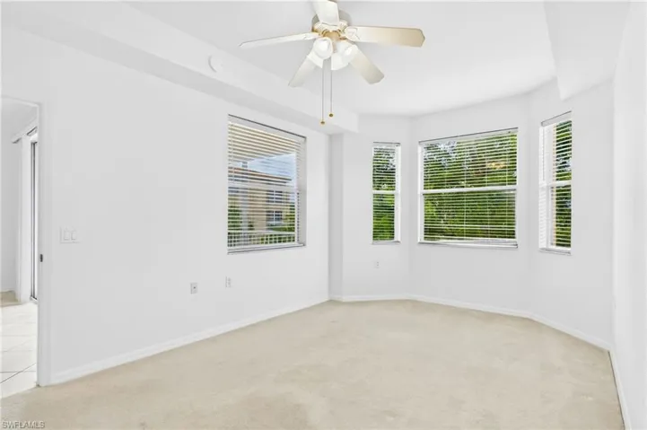 Spacious bedroom offering a peaceful retreat with natural light and comfort.