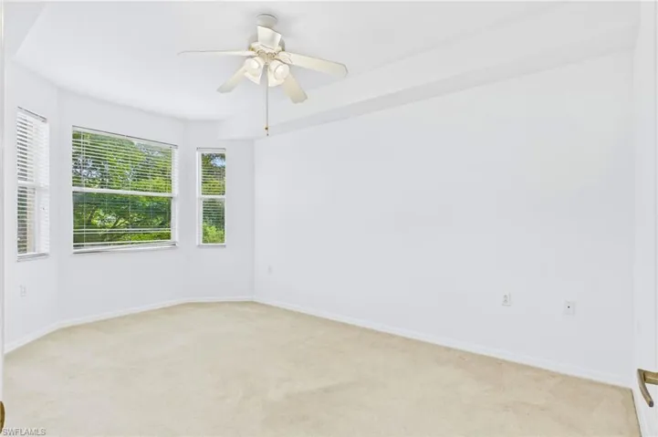 Comfortable primary bedroom with a calm atmosphere and generous layout.