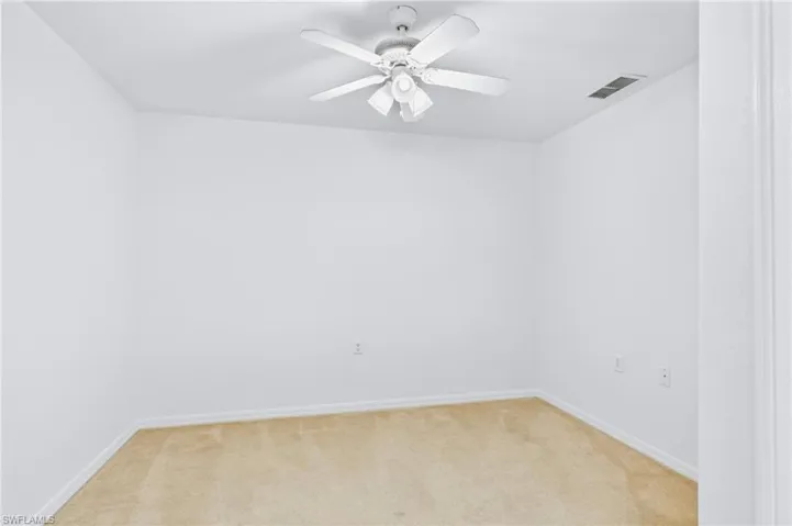 Flexible den space perfect for a home office, study area, or additional lounge.