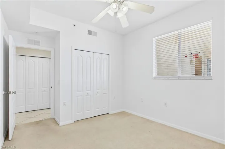 Spacious bedroom offering a peaceful retreat with natural light and comfort.
