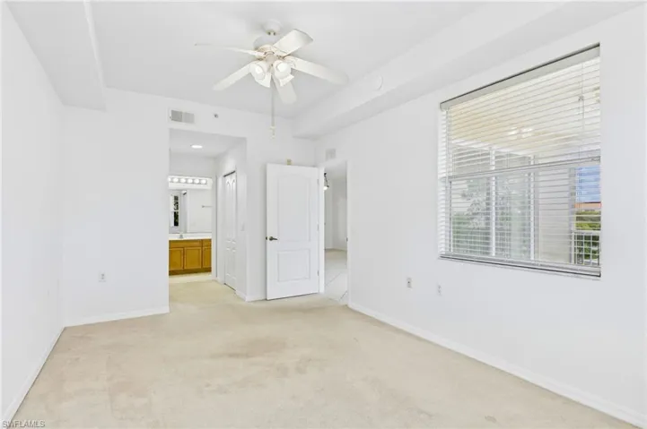 Spacious bedroom offering a peaceful retreat with natural light and comfort.