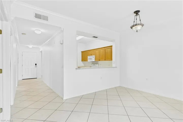 Bright and open living room seamlessly connected to the kitchen, creating a perfect space for everyday living and entertaining.