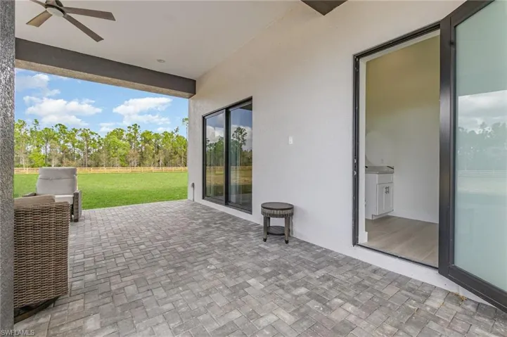 View of patio with ceiling fan