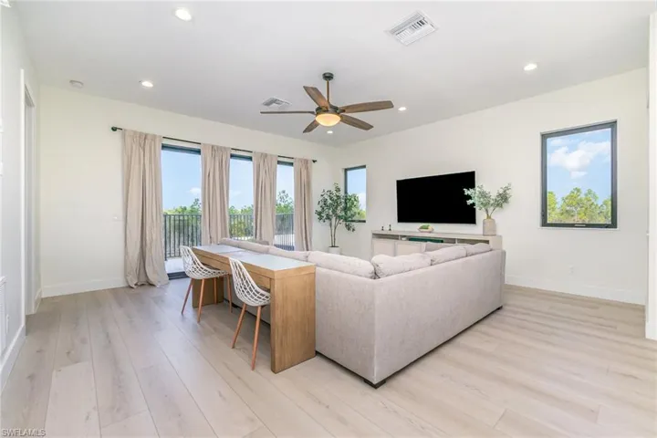 Second floor living room featuring light wood-type flooring, recessed lighting, and a ceiling fan