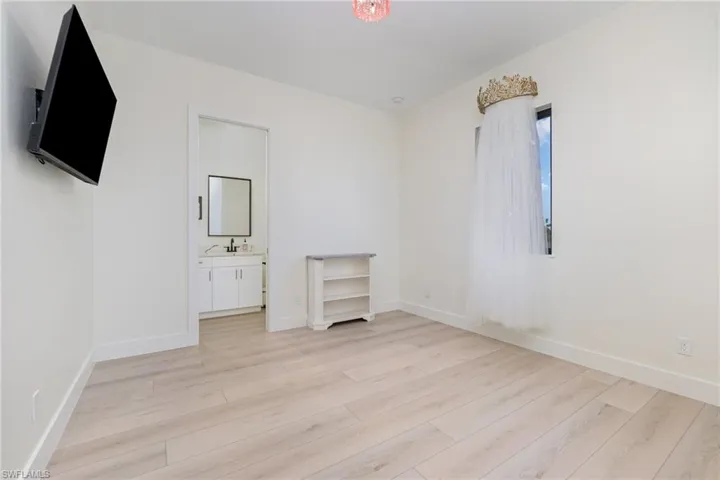 Empty room with baseboards and light wood-style floors