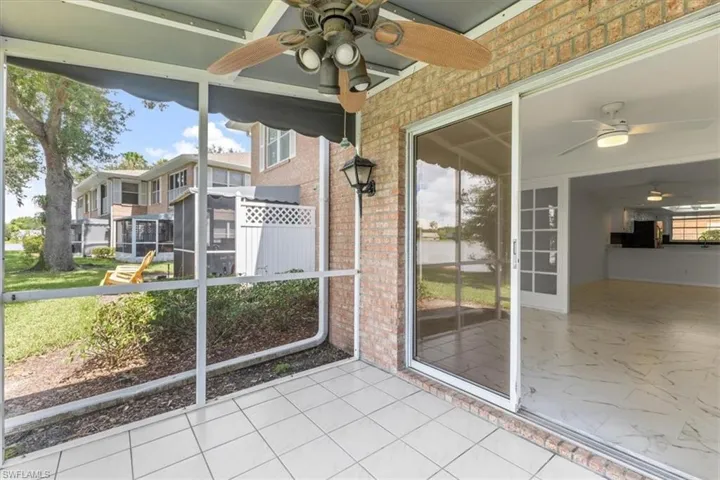 Unfurnished sunroom featuring ceiling fan and a wealth of natural light