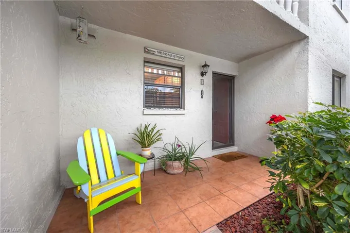 Doorway to property with covered porch