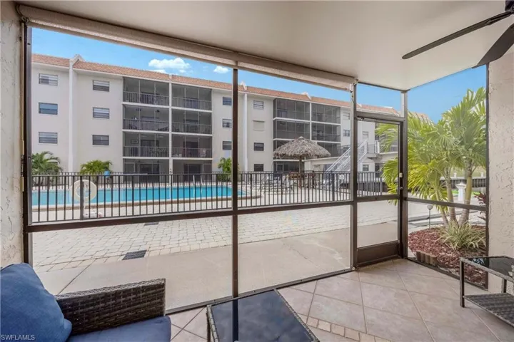 Unfurnished sunroom with ceiling fan