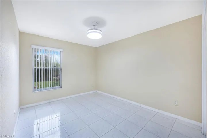 Spare room featuring baseboards