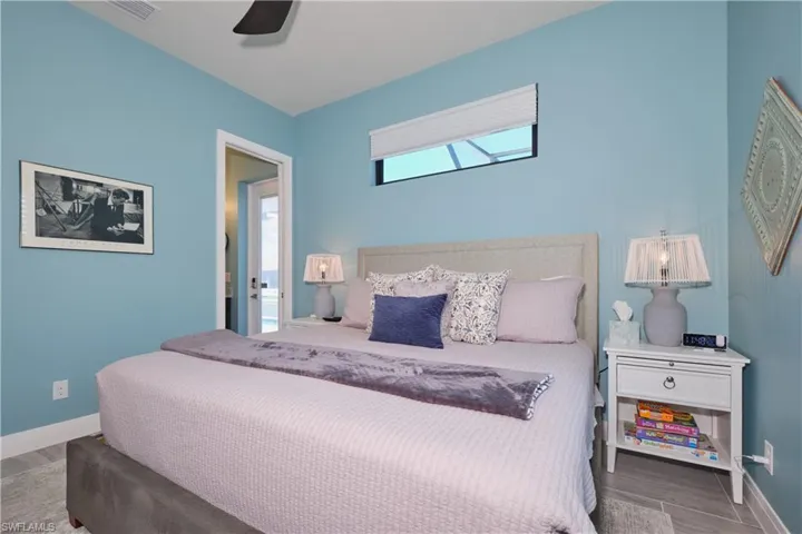 Bedroom featuring ceiling fan and hardwood / wood-style flooring