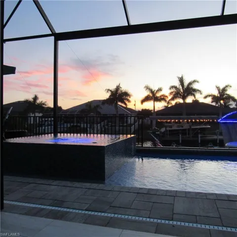 View of pool at dusk