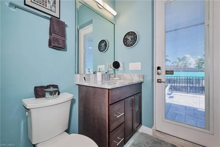 Bathroom with tile patterned flooring, vanity, and toilet