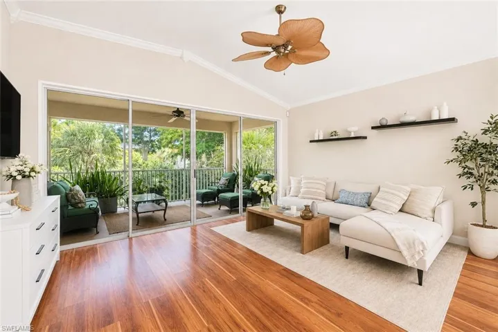 Tile and wood flooring throughout, high-end baseboards and crown molding, and plantation shutters.