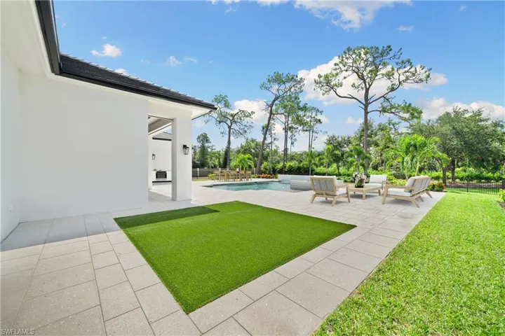 View of yard with outdoor lounge area and a patio