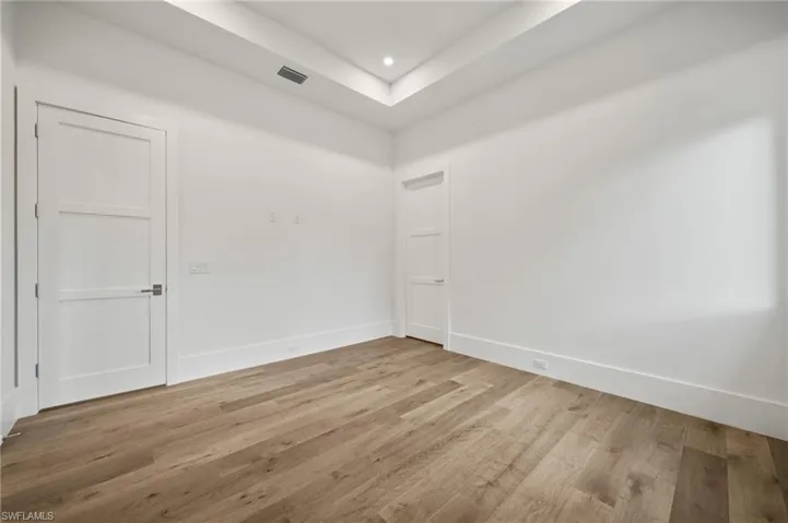 Spare room with light wood-type flooring