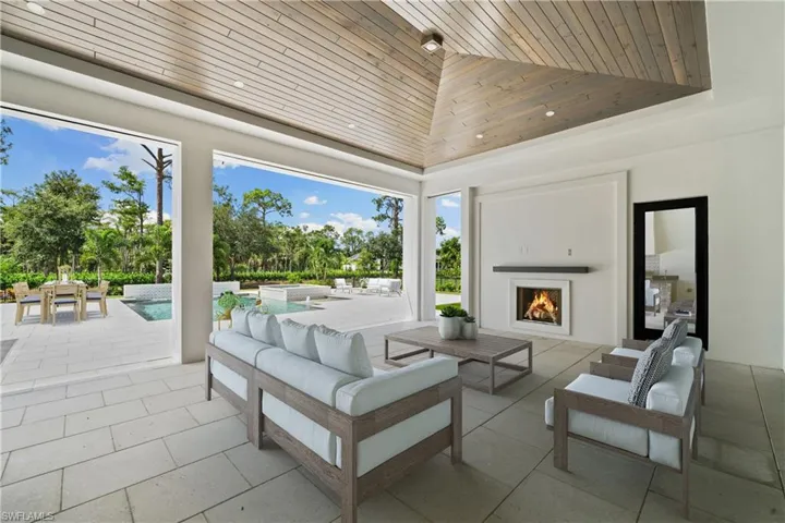 View of patio / terrace with an outdoor living space with a fireplace