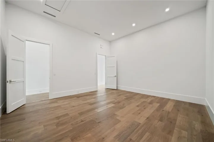 Spare room featuring hardwood / wood-style floors
