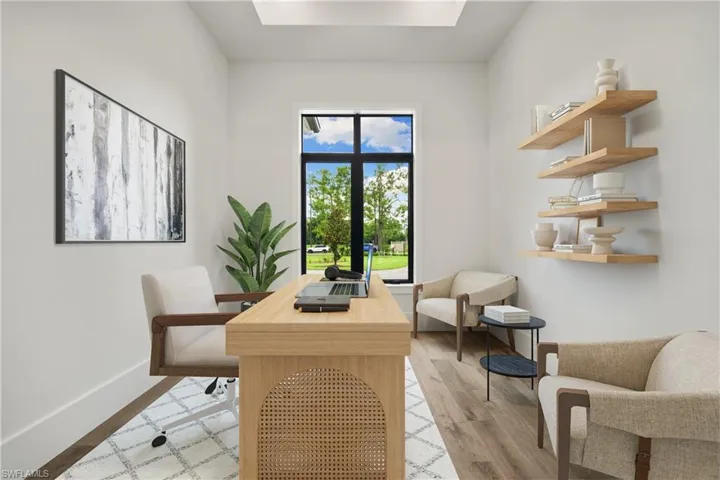 Office area featuring light hardwood / wood-style floors