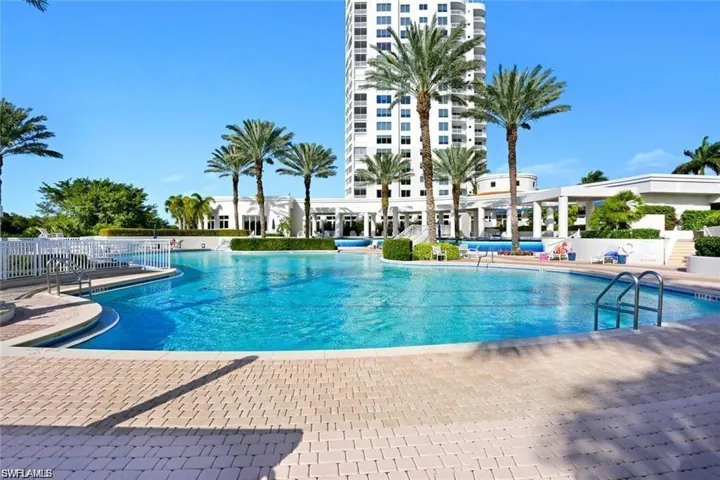 Pool featuring a patio area and fence