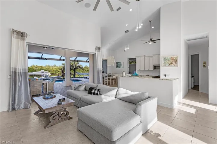 Living Room w/ ample seating and pool view