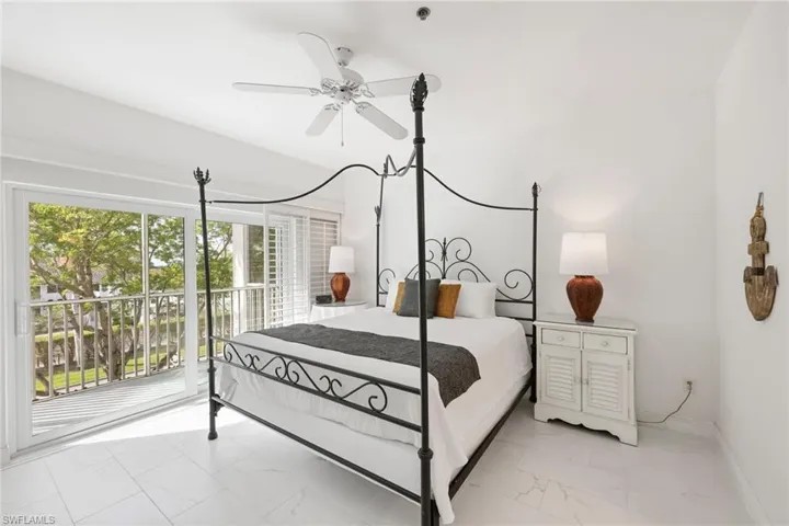 Bedroom with ceiling fan and access to exterior