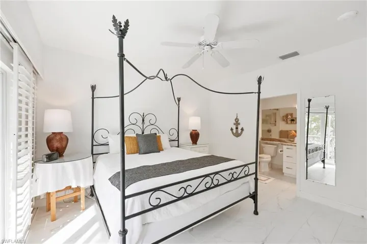 Bedroom with ensuite bathroom and ceiling fan