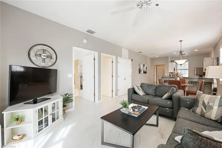 Living room featuring ceiling fan