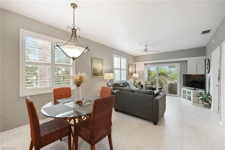 Dining room with a wealth of natural light and ceiling fan
