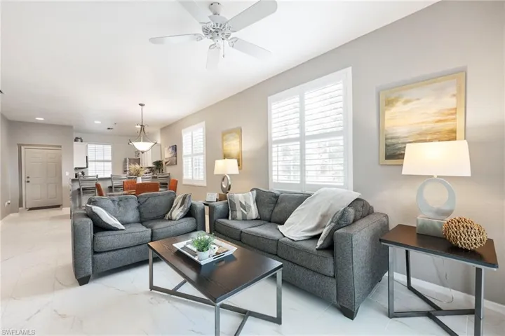 Living room featuring ceiling fan