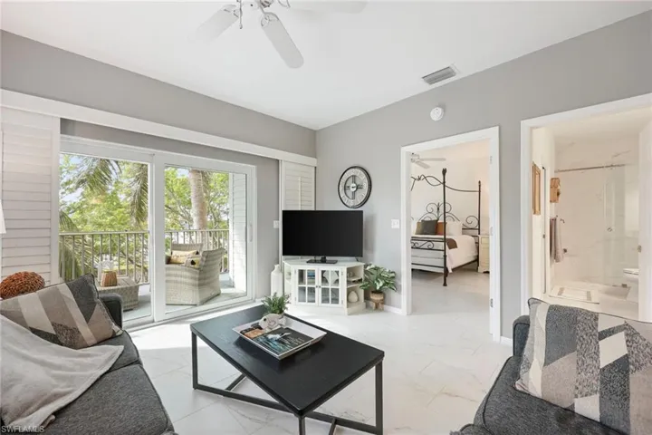 Living room featuring ceiling fan