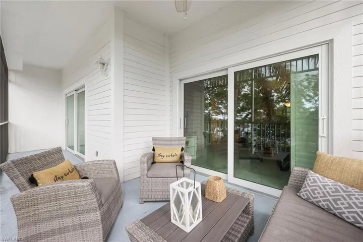 Balcony with ceiling fan and a patio area