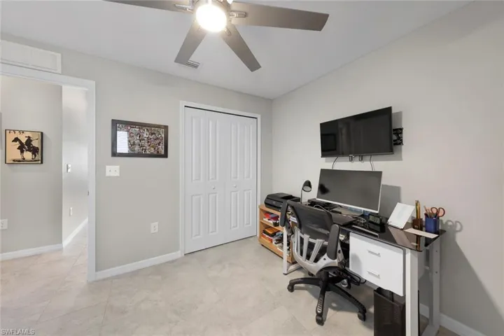 Tiled office featuring ceiling fan (4th bed if needed)