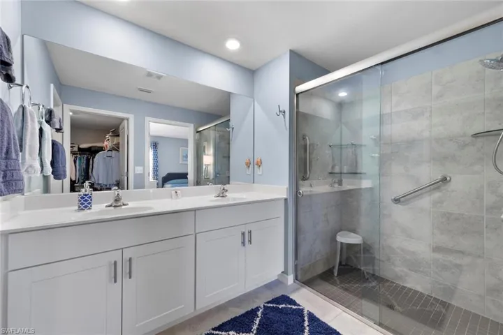 Bathroom with vanity and an enclosed shower