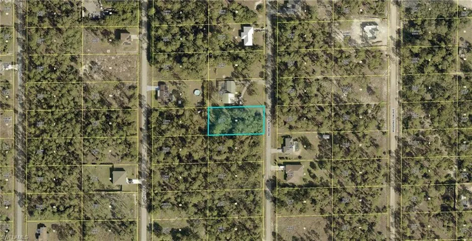 Aerial map of property and surrounding area featuring property boundaries highlighted