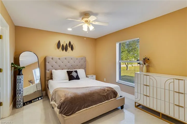 Bedroom with recessed lighting, baseboards, and a ceiling fan