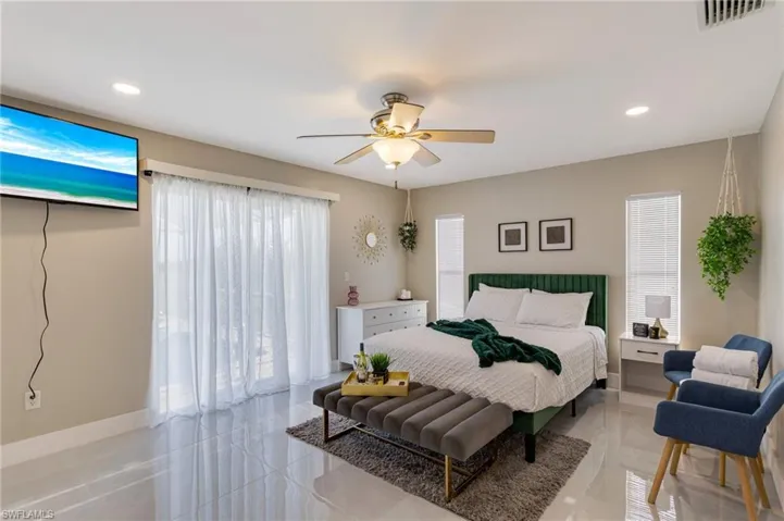 Bedroom featuring ceiling fan, baseboards, visible vents, and recessed lighting