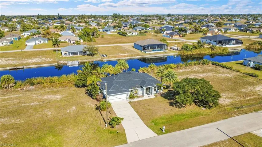 Aerial perspective of suburban area with a large body of water