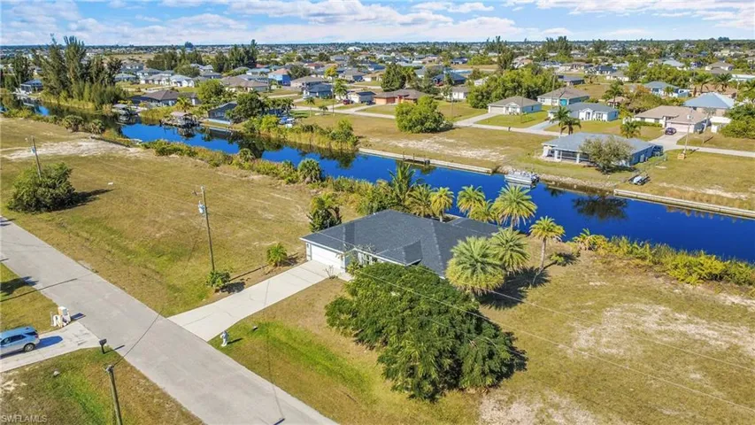 Aerial view of residential area with a large body of water