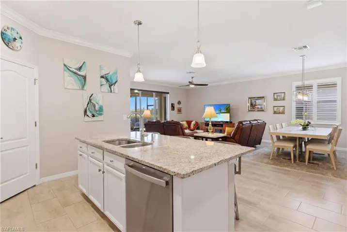 Beautiful kitchen featuring granite countertops, modern appliances, and a spacious walk-in pantry for exceptional storage.