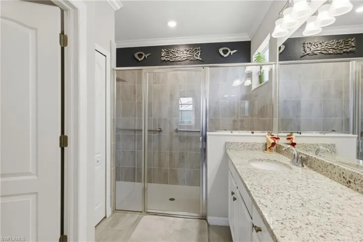 Elegant primary bathroom offering a generous walk-in shower and a functional, open layout.