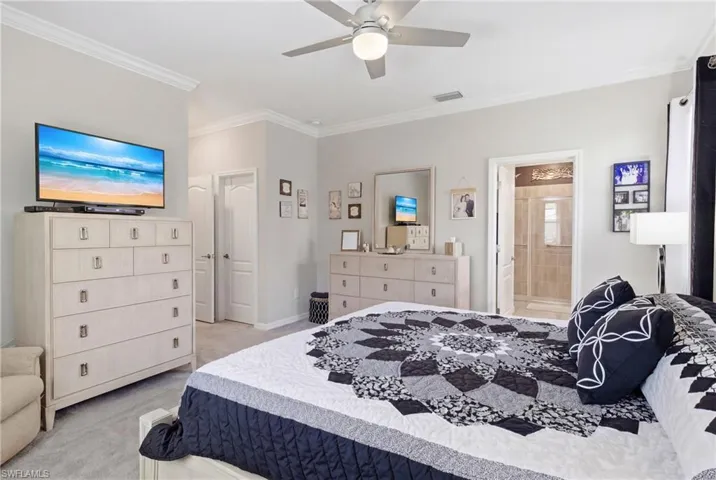 Spacious primary suite offering a private retreat with elegant finishes and oversized walk-in closets.