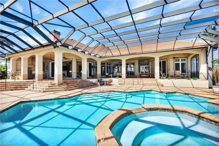 Large Covered Lanai, Outdoor Kitchen, Custom Pool and Spa all with endless water views
