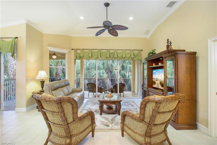 Living room overlooking the lanai with private, preserve view