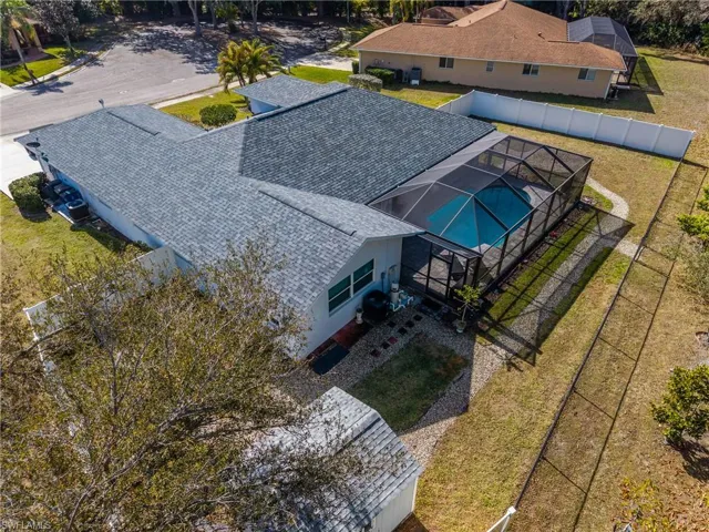 Aerial view of property and surrounding area with a pool