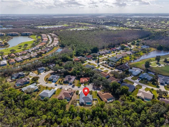 View of property location featuring a large body of water and nearby suburban area