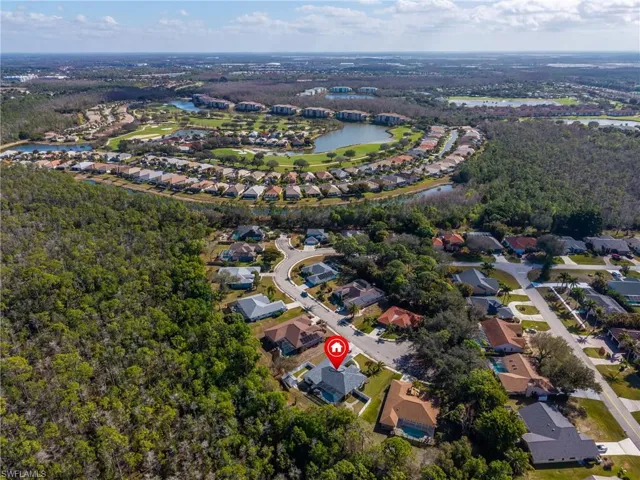 View of property location with nearby suburban area and a large body of water